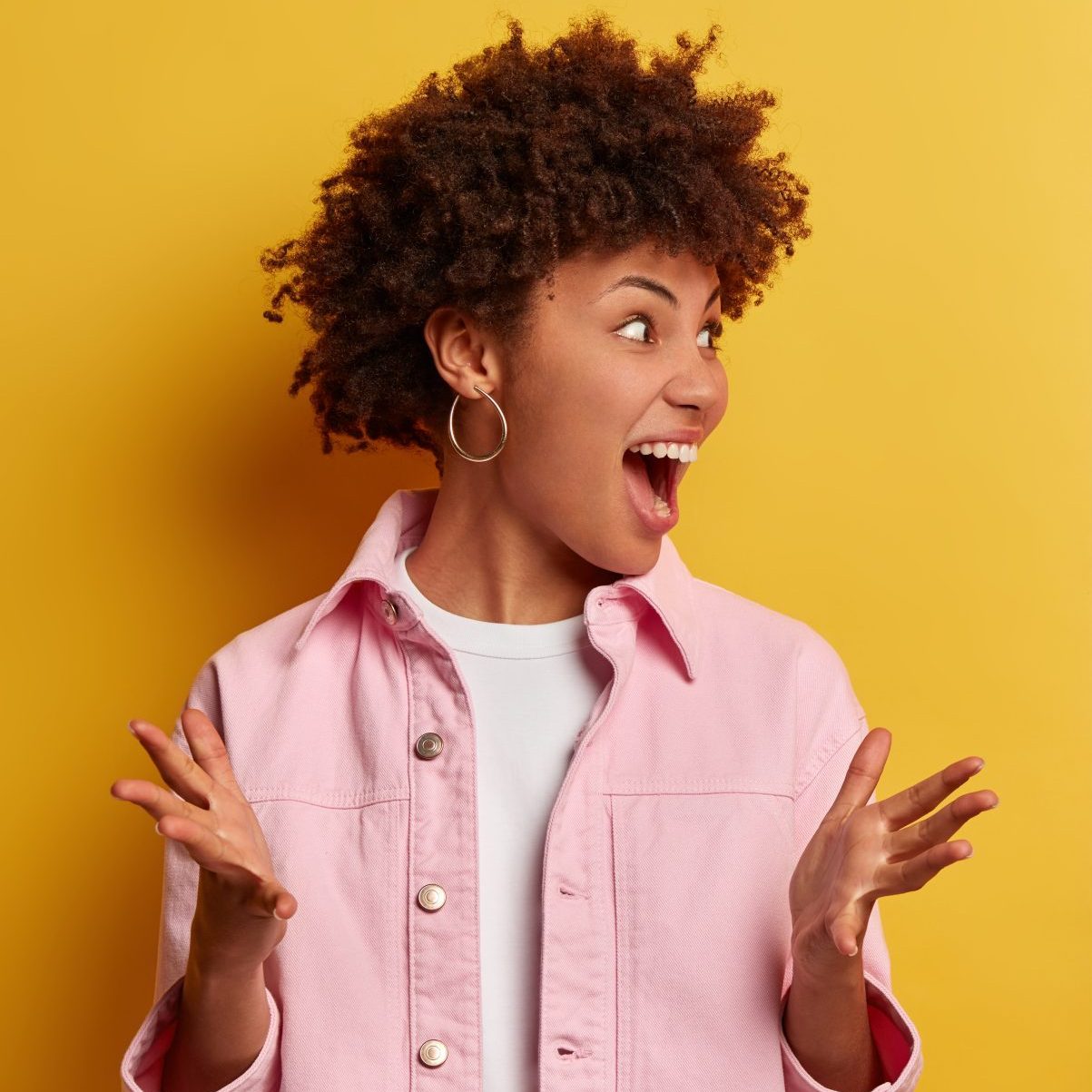 Black couple arguing. Annoyed curly haired woman gestures angrily, displeased man made bad mistake, feels sorry, cries from despair, listens wifes quarreling with guilty expression. Relationship